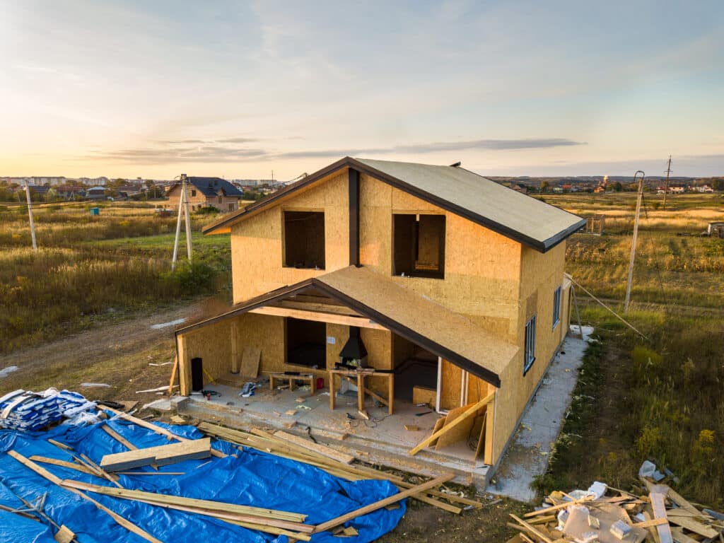 Construction of new and modern modular house Walls made from composite wooden sip panels with styrofoam insulation inside Building new frame of energy efficient home concept